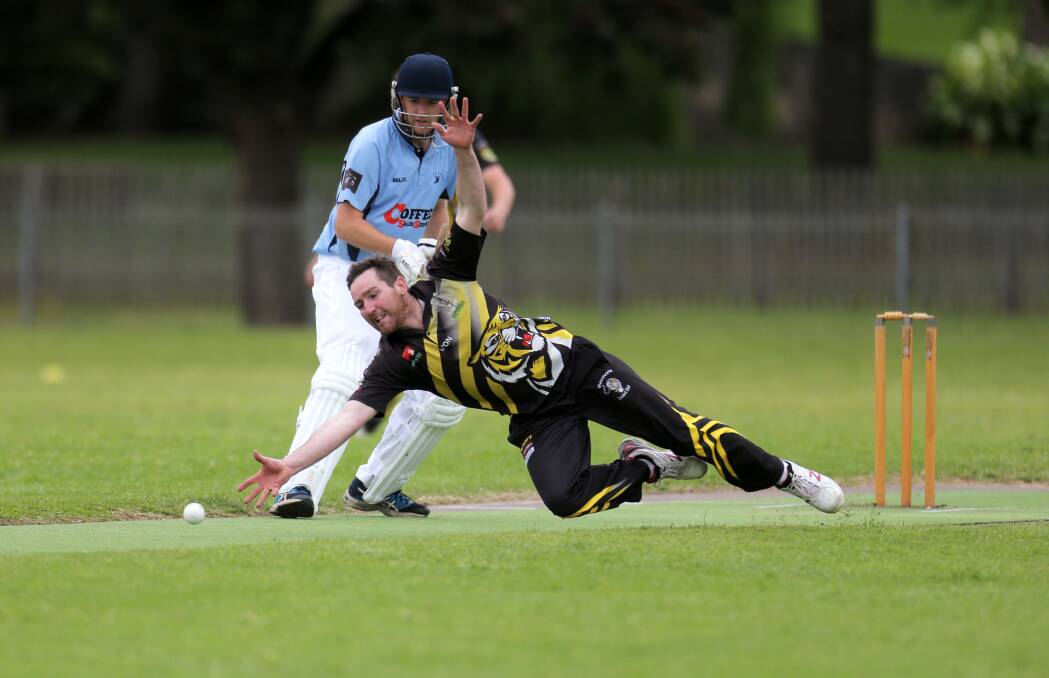 Josh Stapleton dives to stop a straight drive along the pitch. Picture: Rob Gunstone
