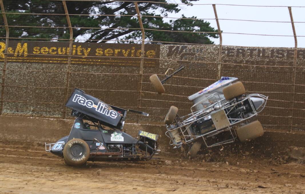 PARTS FLYING: American Tim Kaeding (left) collides with Rusty Hickman spectacularly in the 10th heat of the night. Picture: Robert Lake