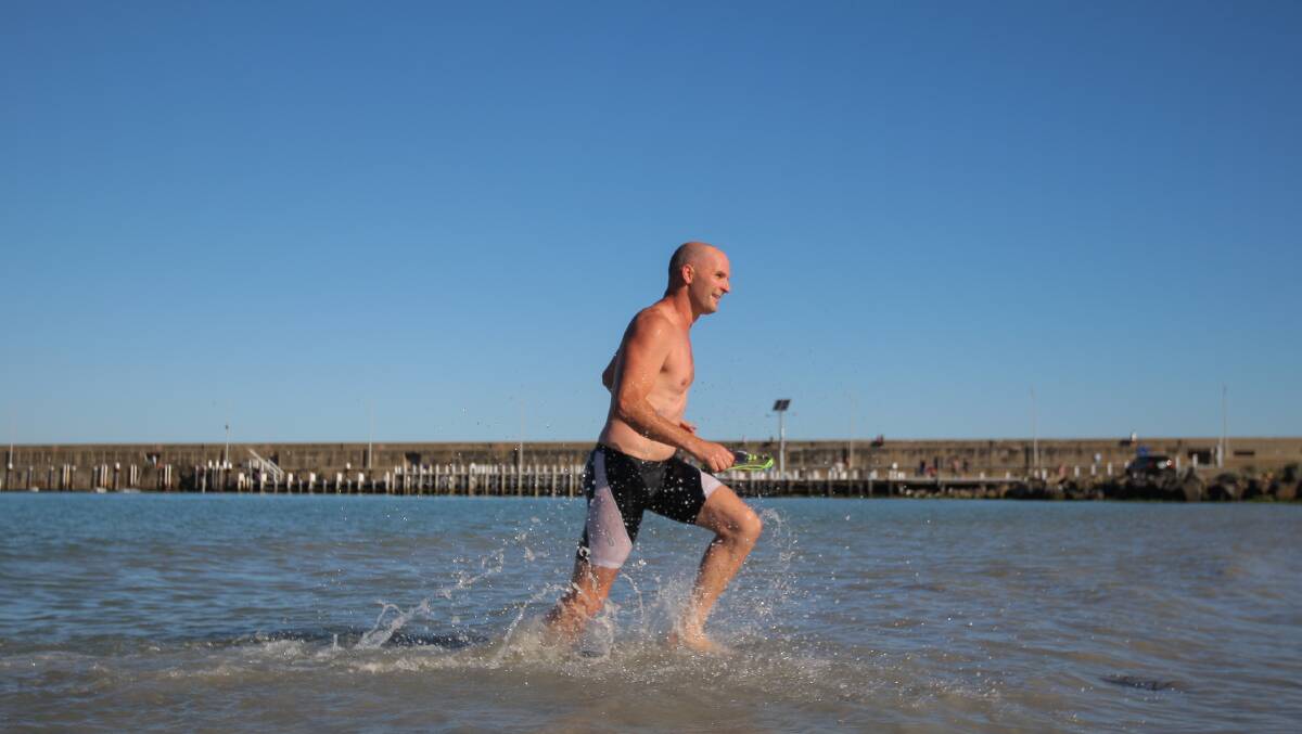 Andy Ryan emerges out of the water during the Warrnambool Tri Club Aquathon, held at the Warrnambool breakwater. Picture: Morgan Hancock