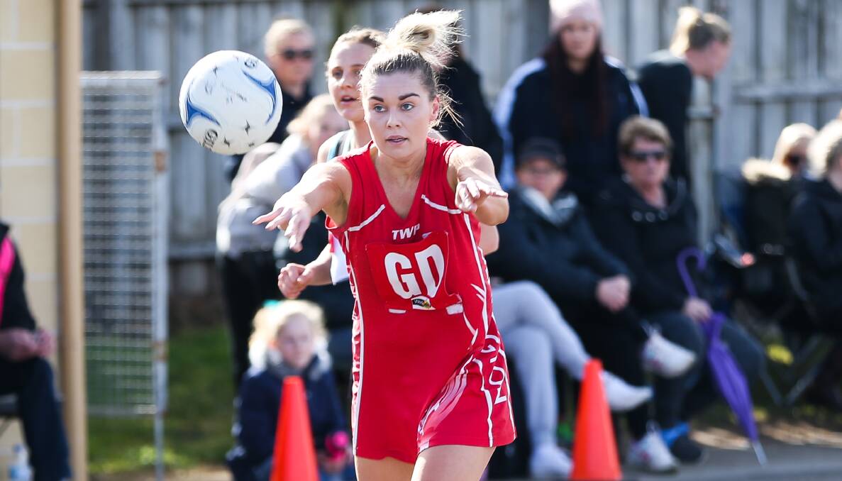 STRONG SHOWING: Dennington's Kristie Bolden passes the ball forward in the Dogs' thrilling qualifying final victory over Kolora-Noorat, which went to overtime. Picture: Morgan Hancock