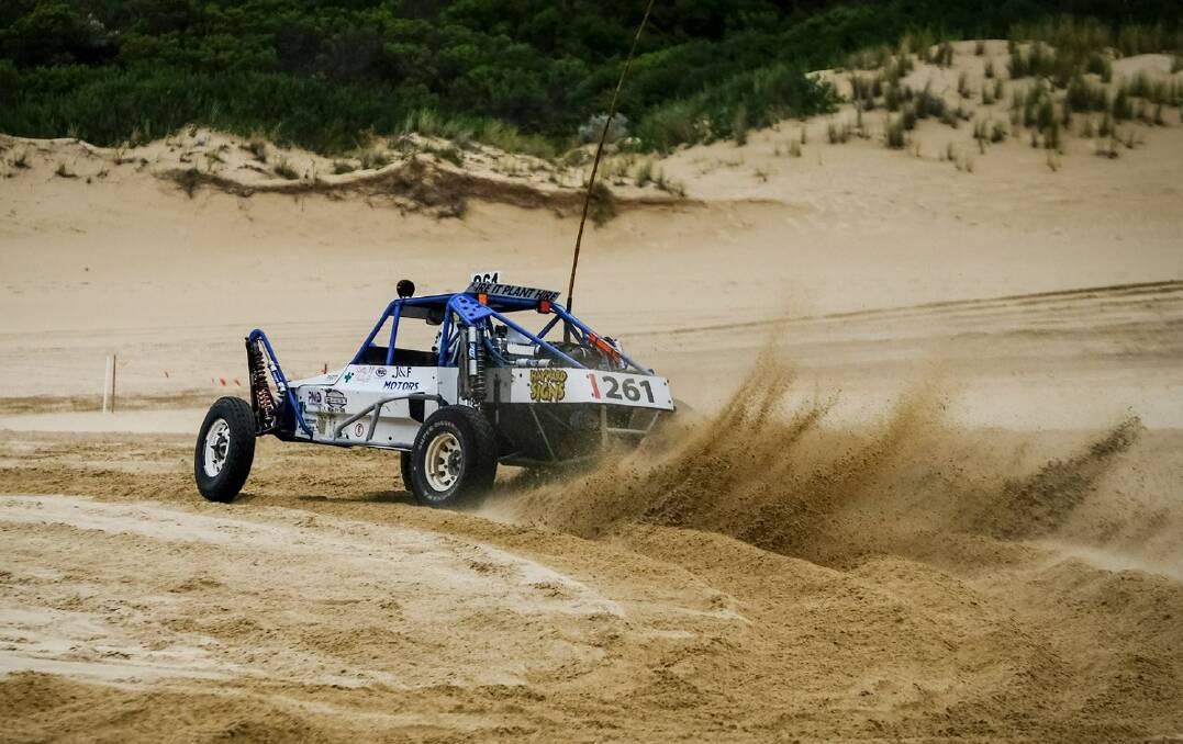 PEDAL TO THE METAL: Terang's Greg Ryan flicks sand while chasing the lead position. Picture: Shay Fraser