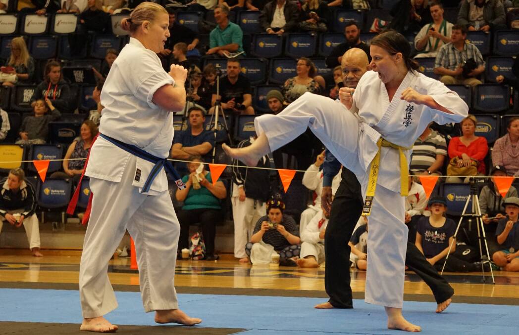 TOUGH TASK: Warrnambool's Serina Bogers in her full-contact semi-final at the Australian Kyokushin Karate National Tournament. Picture: Natalie Jorgensen