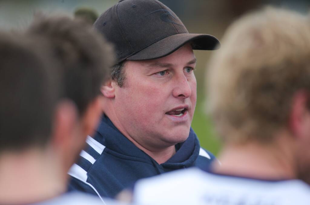 Allansford's co-coach, Ben Holloway speaking to players in the huddle. Picture: Morgan Hancock