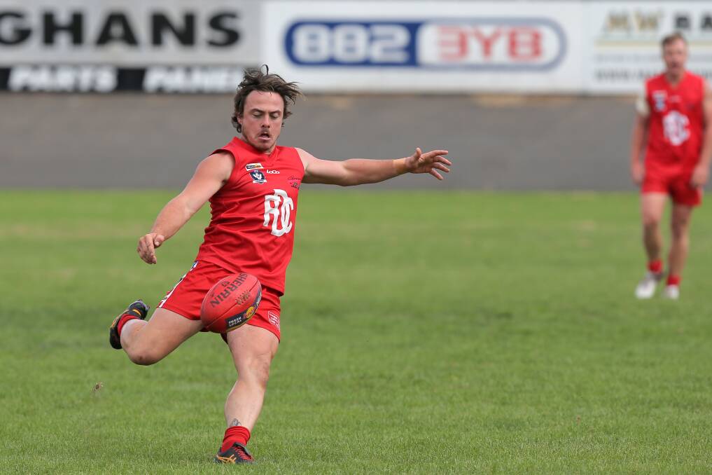 BACK IN: Dennington's Angus Chirnside drives the ball long. Picture: Rob Gunstone