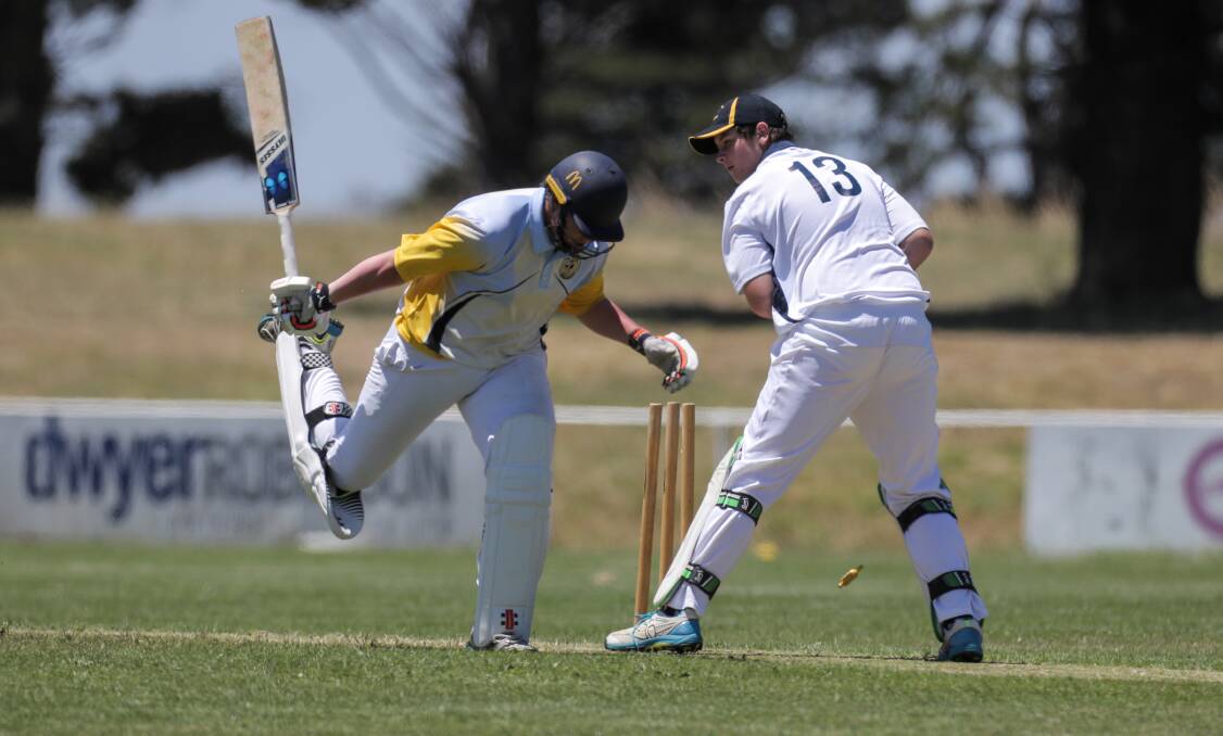 CLOSE CALL: Portland batter Riley Cook makes his ground as Warrnambool keeper Noah Keane whips off the bails. 