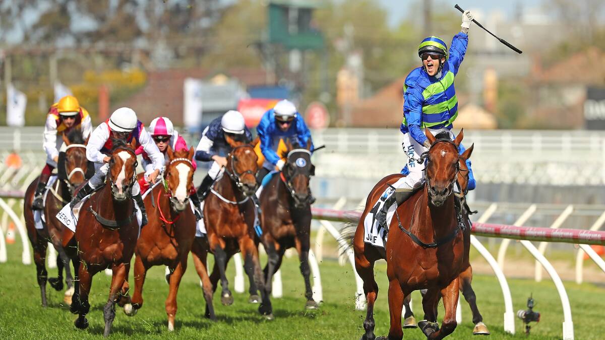 JUBILANT: Nick Hall celebrates abroad Jameka after taking out the Caulfield Cup. Picture: Getty Images