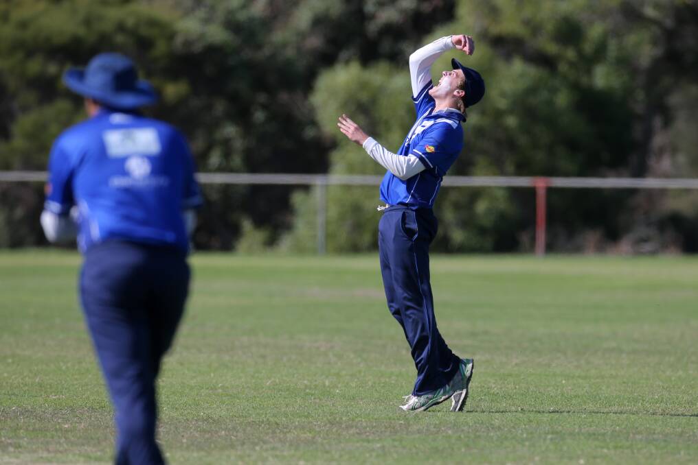FINALLY: Russells
Creek's Connor
Macleod celebrates
after taking the match
winning catch.
Picture: Rob Gunstone