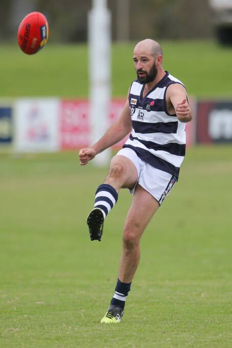 EXPERIENCE: Allansford's Ben Lenehan kicks the football in the Cats' impressive triumph 
over East Warrnambool. Picture: Morgan Hancock