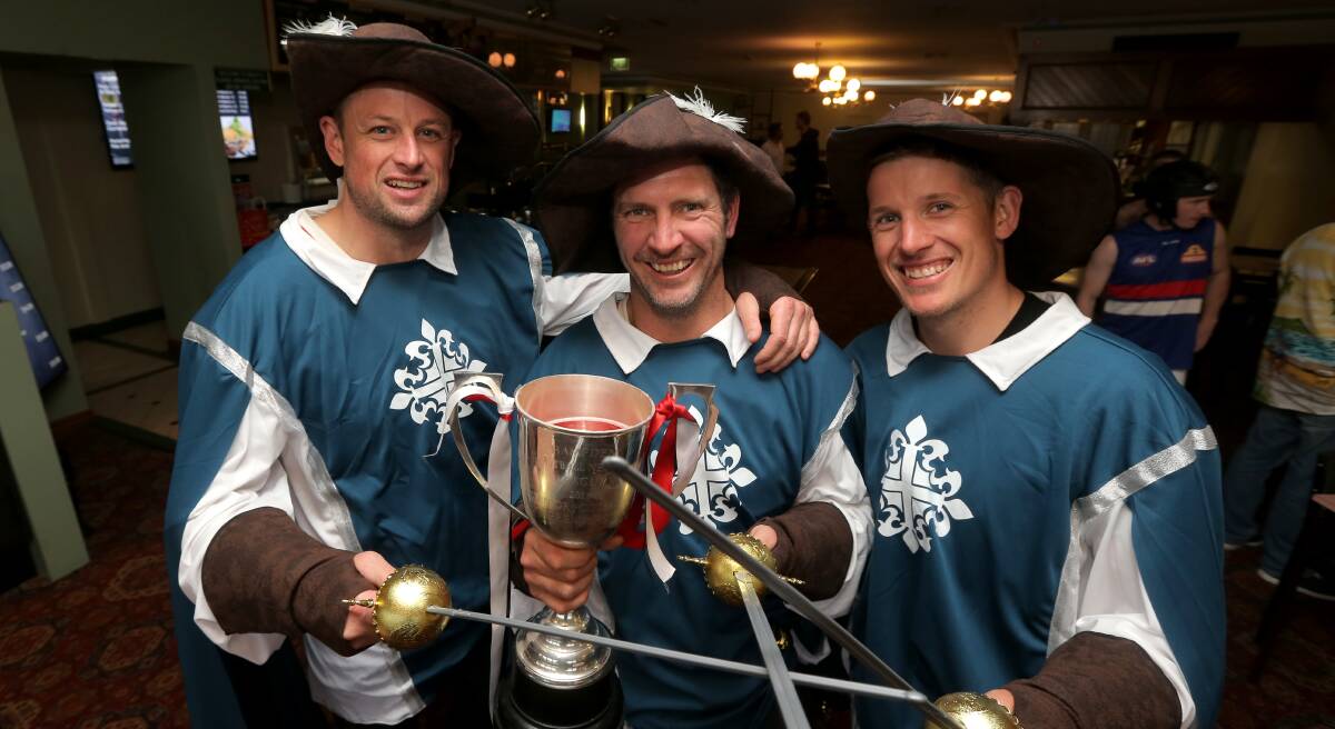 MAD MONDAY: Koroit Saints' players Ethyn Zimmer, Joe McLaren and Tauryn Zimmer dressed as the Three Musketeers after their grand final win. Picture: Rob Gunstone
