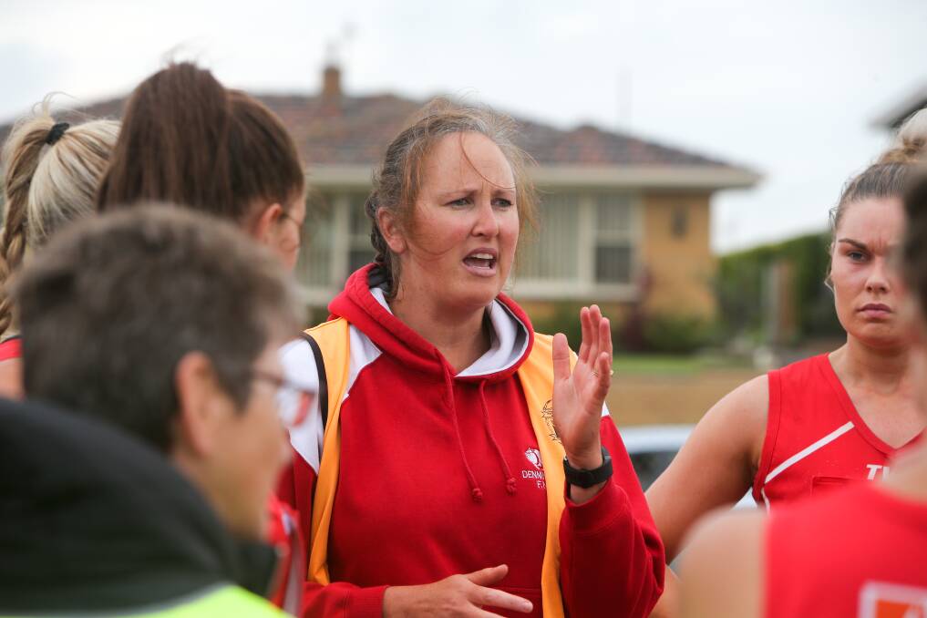 MESSAGE: Dennington coach Sue Fleming talks to her players at the main break of her club's clash with Old Collegians on Saturday.