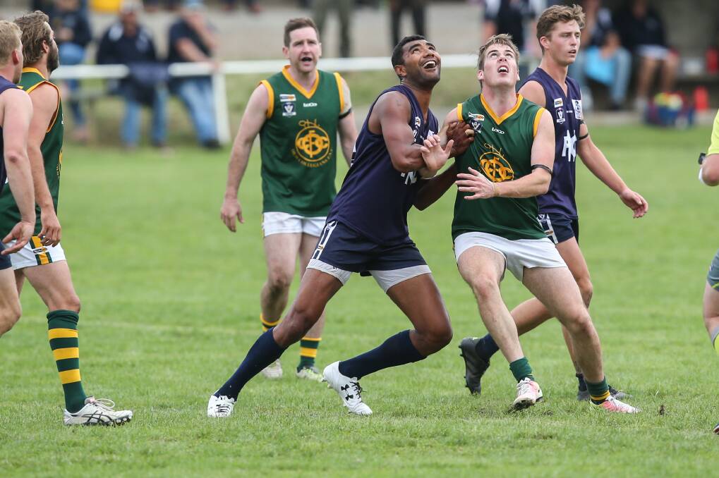 TOUGH BATTLE: Nirranda ruckman Inoke Ratu and Old Collegians' Vincent Fogarty contest the ruck in round one. Picture: Amy Paton