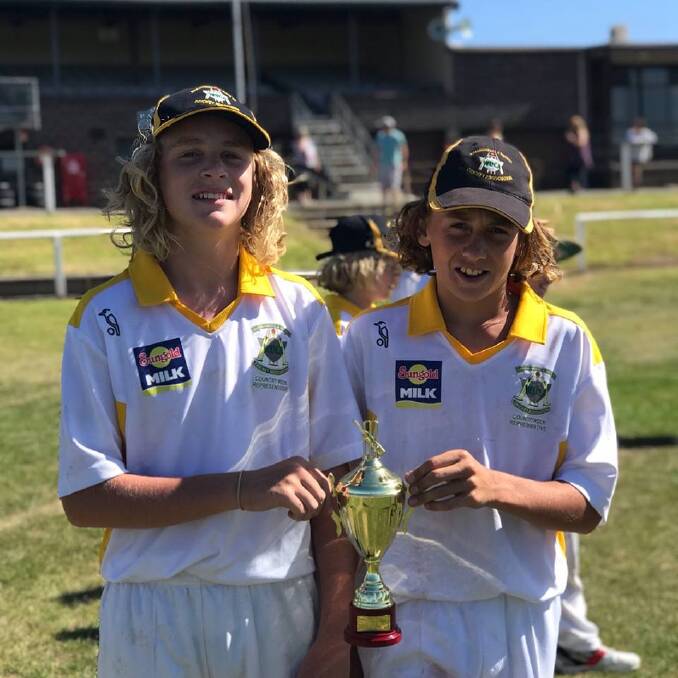 LEADERS: Hugh Fleming and Flynn Wilkinson, the Warrnambool Gold joint captains with the under 13 country week trophy.