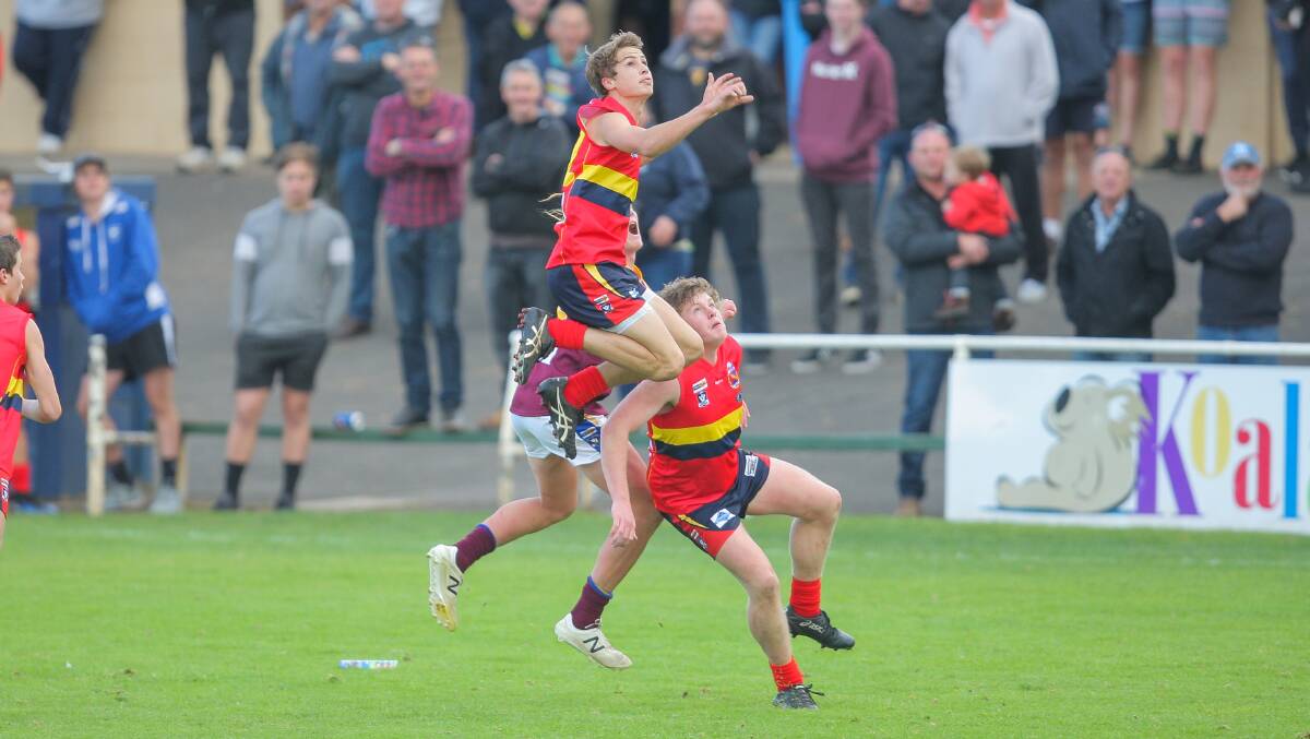 A Warrnambool player flies for a mark in last season's under 17.5 game. Picture: Morgan Hancock