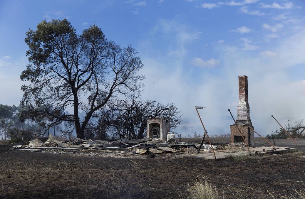 A house is reduced to rubble after being impacted by widespread fires in the Terang region. Picture: Paul Jeffers