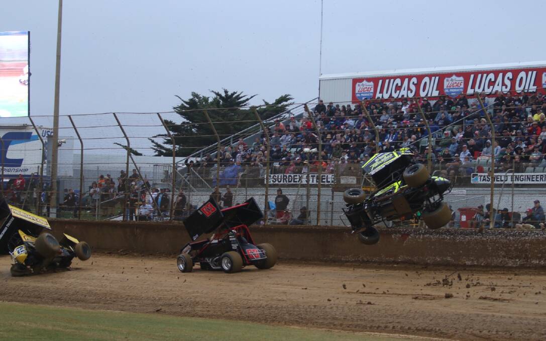 SMASH: Chad Ely goes flying in a three-car smash in heat nine of the South West Conveyancing Grand Annual Sprintcar Classic on Friday. Picture: Robert Lake
