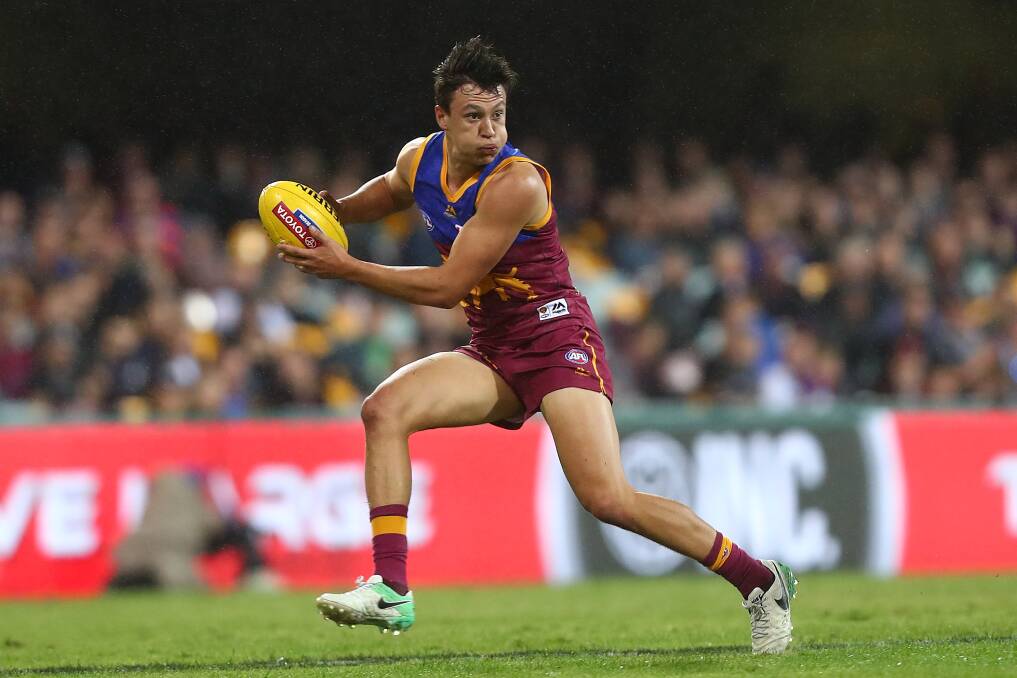 FULL STRETCH: Hugh McCluggage of the Lions runs the ball during the round 12 AFL match between the Brisbane Lions and the Fremantle Dockers. Picture: Getty Images