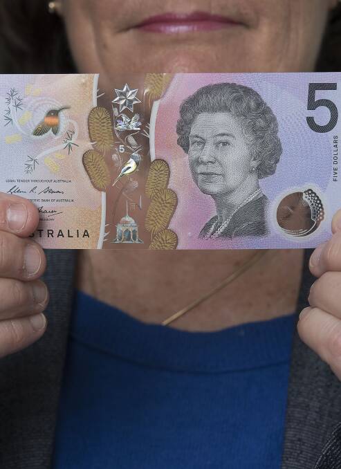 Unfitted: The new $5 bank note isn't a good fit for all machines.
