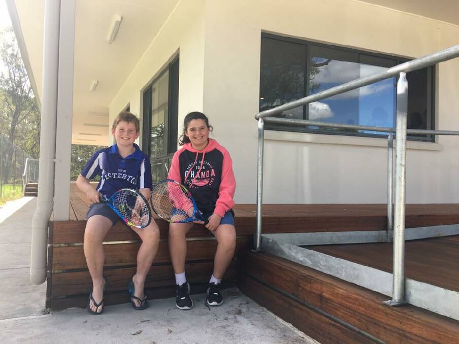 Cash point: Casterton Tennis Club junior stars Oliver and Chloe Foster.