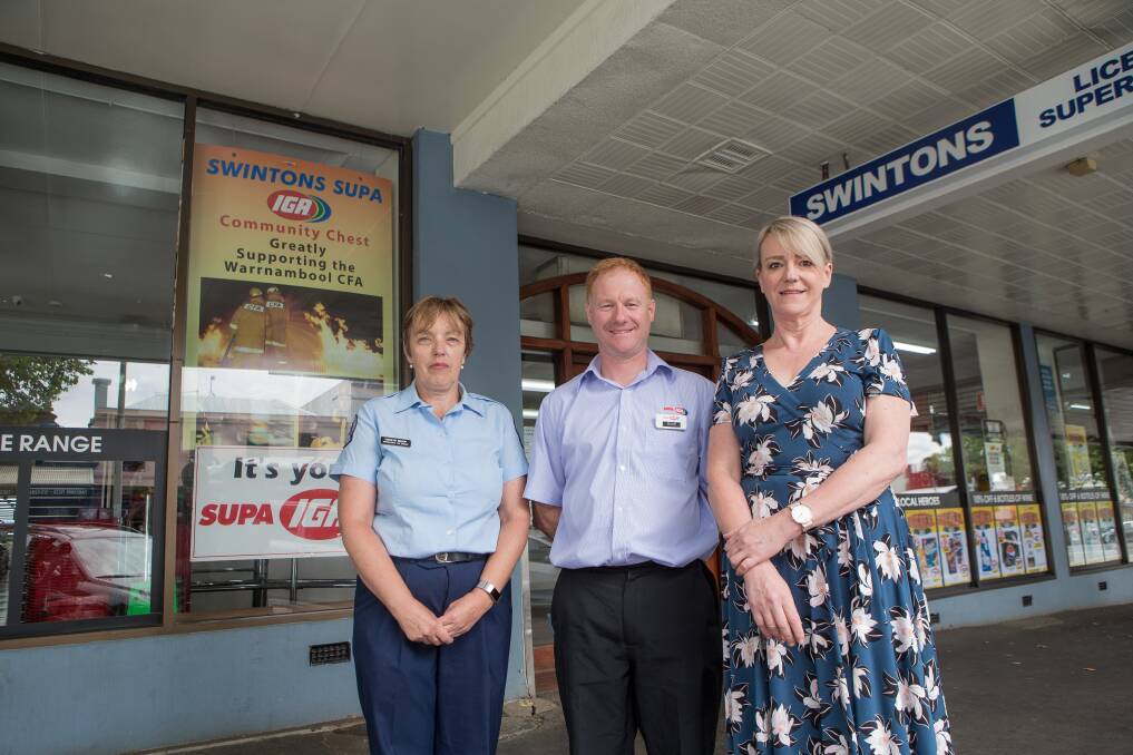 Community chest: Warrnambool CFA volunteer Carolyn Bishop and SWHC's Suzan Morey were delighted when IGA Manager Brett Moloney handed over funds for further community services. Picture: Christine. Ansorge.