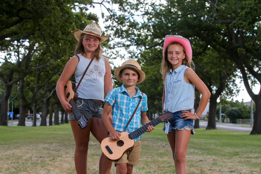 Yee-haw: Siblings Leyla Meric, 10, Emre Meric, 5,and Sema Meric, 9, are ready for the Terang Music Festival this weekend. Picture: Rob Gunstone