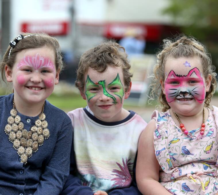 Cheeky fun: Siblings Sophie, 7, Michael, 7, and Olivia Halliday, 5, from Cobden show off the talents of local facepainters at this year's festival. Picture: Amy Paton