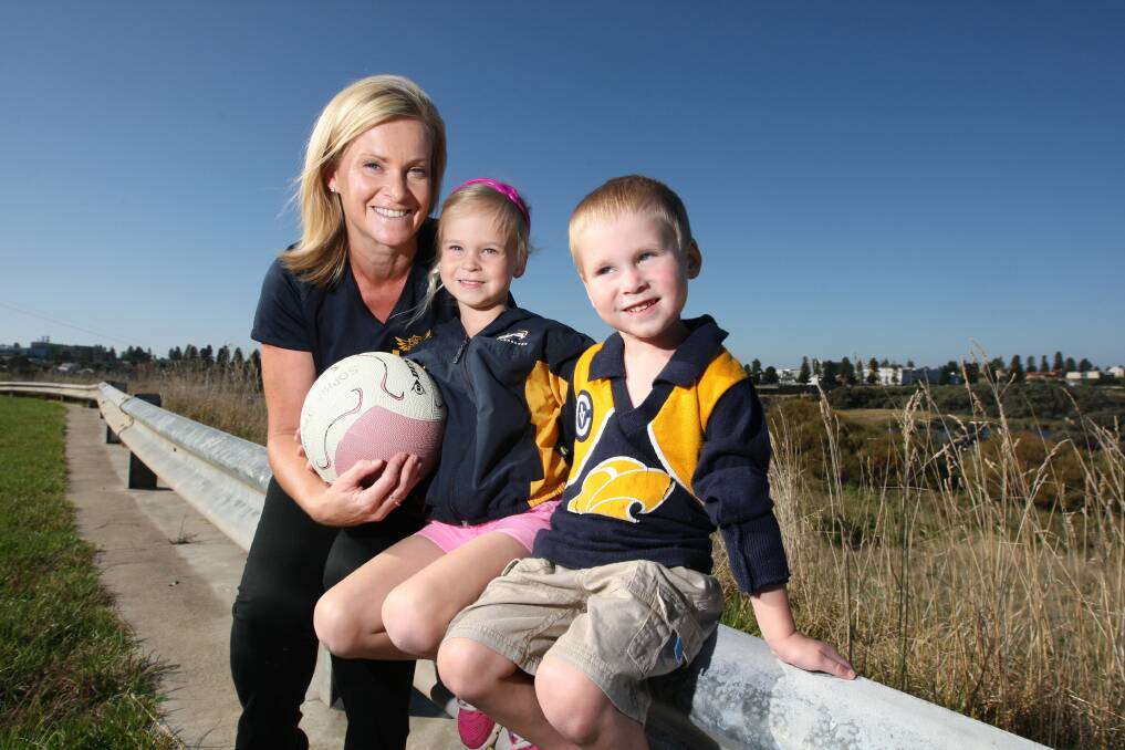 Mum's the word: North Warrnambool netballer and mother-of-two Angela Jellie was caught up in the south-west bushfires on the weekend. Pictured here in 2013 with children Sophie and Charlie.
