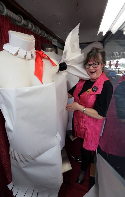 Fashionista: Uniting Church Op Shop window dresser Lyn Turner is working on keeping the mystery surrounding her paper outfits. Picture: Rob Gunstone