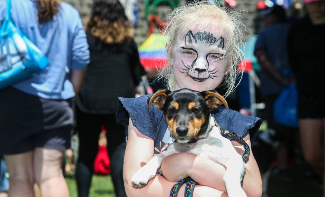 Love: Liddell Finnigan, 6 of Port Fairy, with 3-month-old fox terrier Molly who strutted her stuff in the pet parade on Port Fairy's Fiddlers Green. Picture: Amy Paton