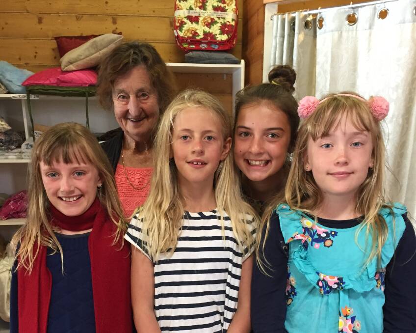 Giving: Darcia Barker, 9, Anglesea, Edie Scanlon, 8, Anglesea, Nina Fitzsimmons, 12, Port Fairy and Dharma Barker, 10, Anglesea used their holidays to raise money for Lifeline. They are pictured with Lifeline volunteer Val Farley. 
