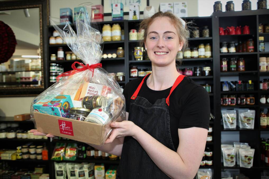 Out of the box: Pronto Fine Foods employee Sian Ryan is busy keeping up with food-lovers shopping lists in the lead up to the big day. Picture: Anthony Brady.