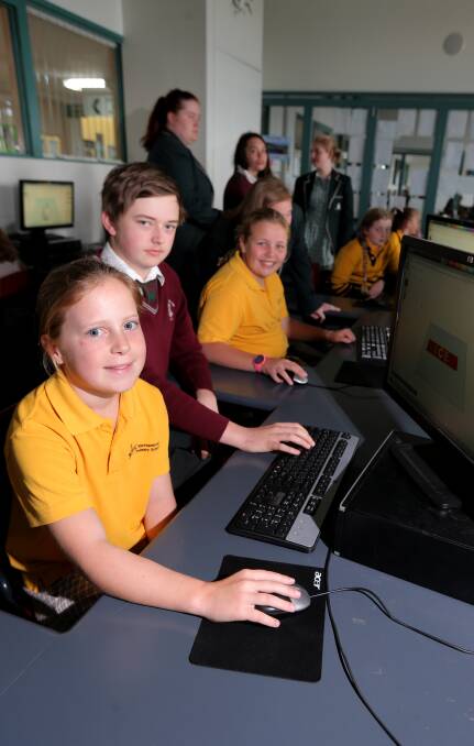 New role: Warrnambool Primary grade 5 student Lacey Gleeson, 11, and Brauer College VCAL student Liam O'Donahue, 18, are learning a new role. Picture: Rob Gunstone