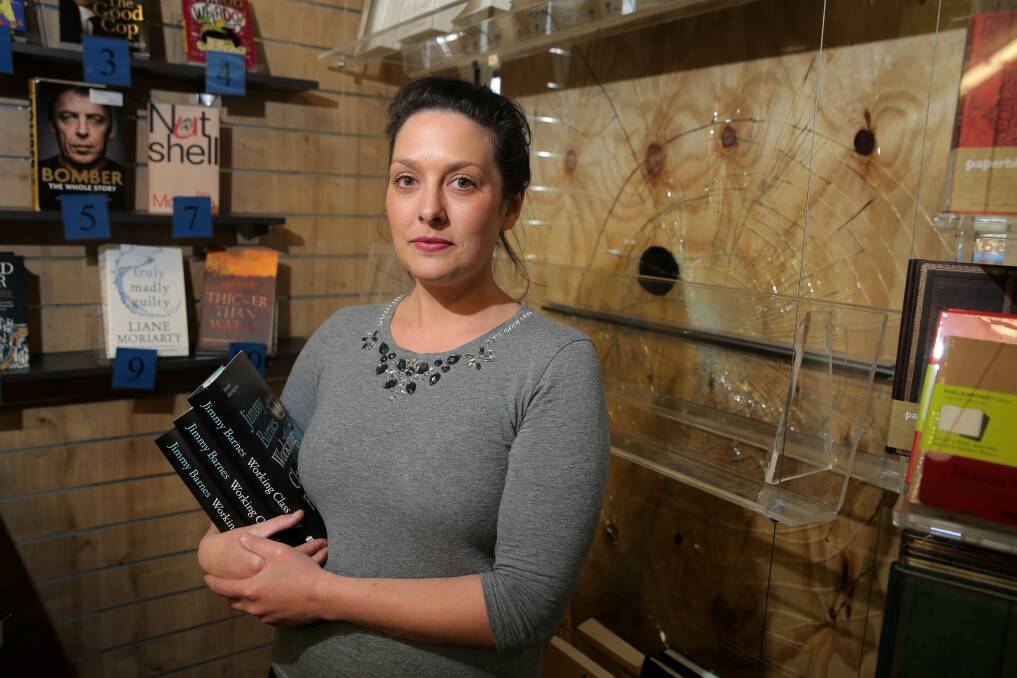 A crime for the books: Collins Booksellers store manager Cassie Carroll was surprised to find the front window of the store smashed when she arrived for work on Wednesday. Picture: Rob Gunstone