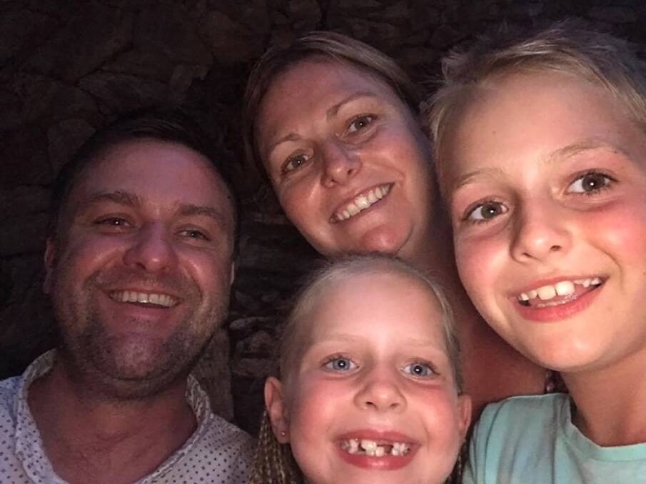 ALL SMILES: Joanne and Tim Brown are enjoying a family holiday in Bali with their children Zachary, 9, and Grace, 6. Their motel room shook during Wednesday morning's earthquake.