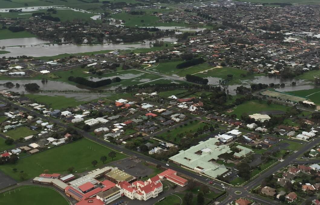 Wet spring: The swollen Russells Creek and Merri River can be seen in this photo looking north over Warrnambool's Emmanuel College. Picture: Port Fairy Helicopters