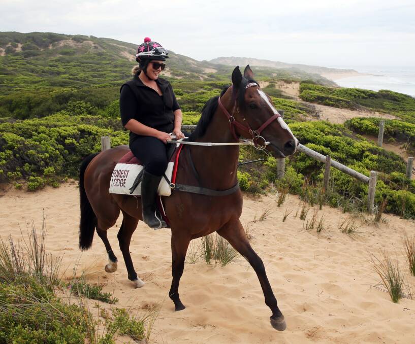 Beached: Melbourne Cup winner Prince Of Penzance and Maddie Raymond work the Levy's Point dunes. Councils are considering cutting access to beaches, which could hurt the district's training industry. Picture: Rob Gunstone