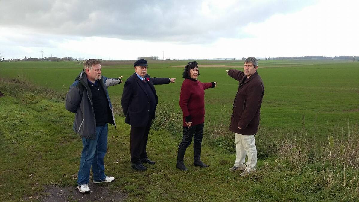 Battle ground: Portland's Rick Rowbottom (left), Port Fairy's Max and Maria Cameron and French author and activist Gilles Durand survey the Bullecourt battlefield earmarked for a wind farm. 