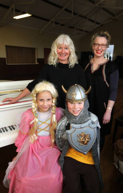 On stage: Warrnambool Primary students Ruth Wilkens, 9, and Christopher Noll, 10, joined opera singers Christine Heald and Anita Senior on stage. Picture: Rob Gunstone