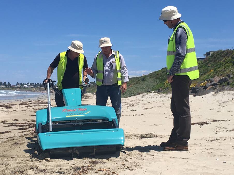 Wannon Water employees at Port Fairy's East Beach trialling using a mechanical beach cleaner to help collect nurdles.
