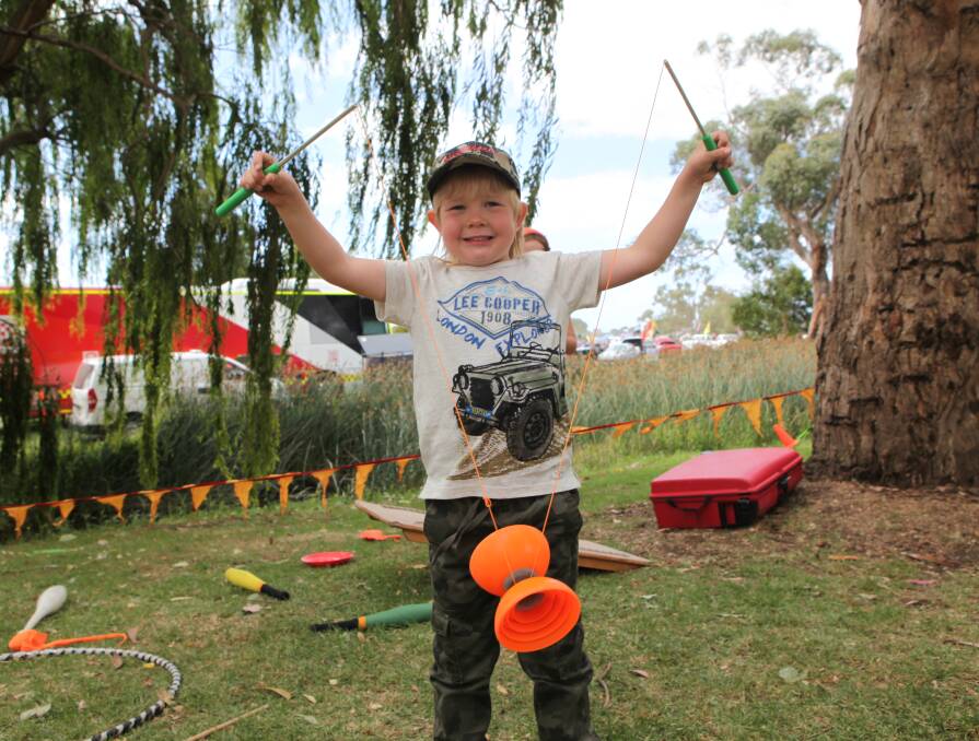All smiles: Levi Staude, 5, from Mount Gambier, was enjoying himself at Heywood's Wood, Wine and Roses Festival on Saturday.
