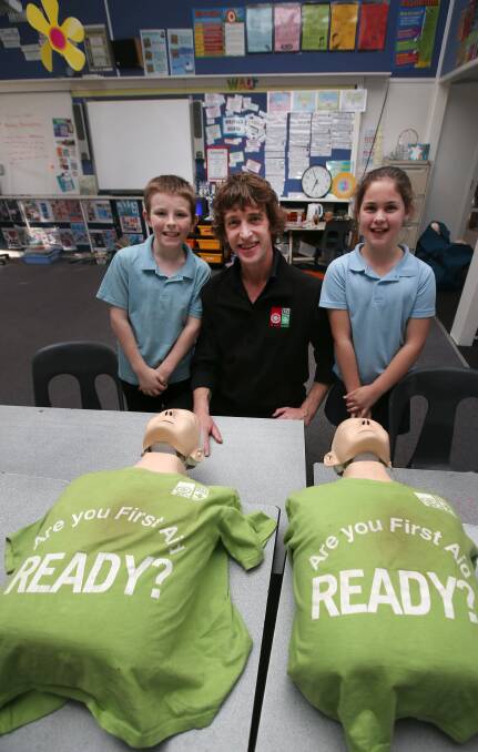 Confidence: St John Ambulance first aid instructor Neal Ripper showed grade five students Brandon Grose and Abbey Lacey, both 10, first aid basics. Picture: Amy Paton