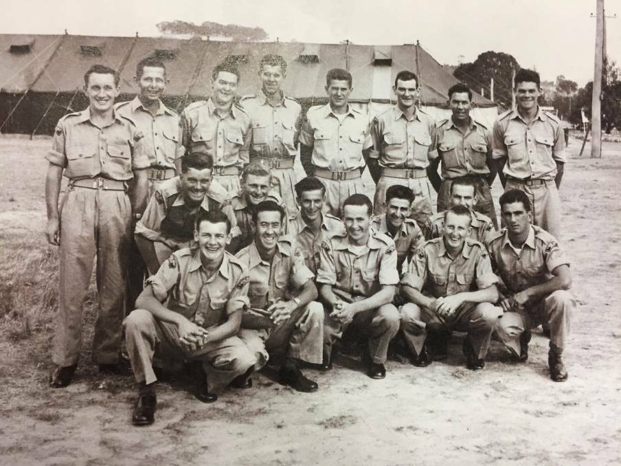 The group shot captured by photographer Robert Suggett that reunited four members of the 14th National Service Training Battalion, Royal Australian Artillery, 1957.