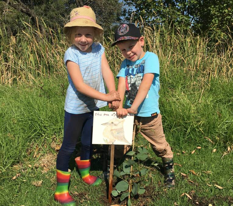 Feathered friends: Siblings Layla and Darcy Drummond drew this sign to let people know that the trees they helped plant will attract more birds to Russell Creek in Warrnambool.
