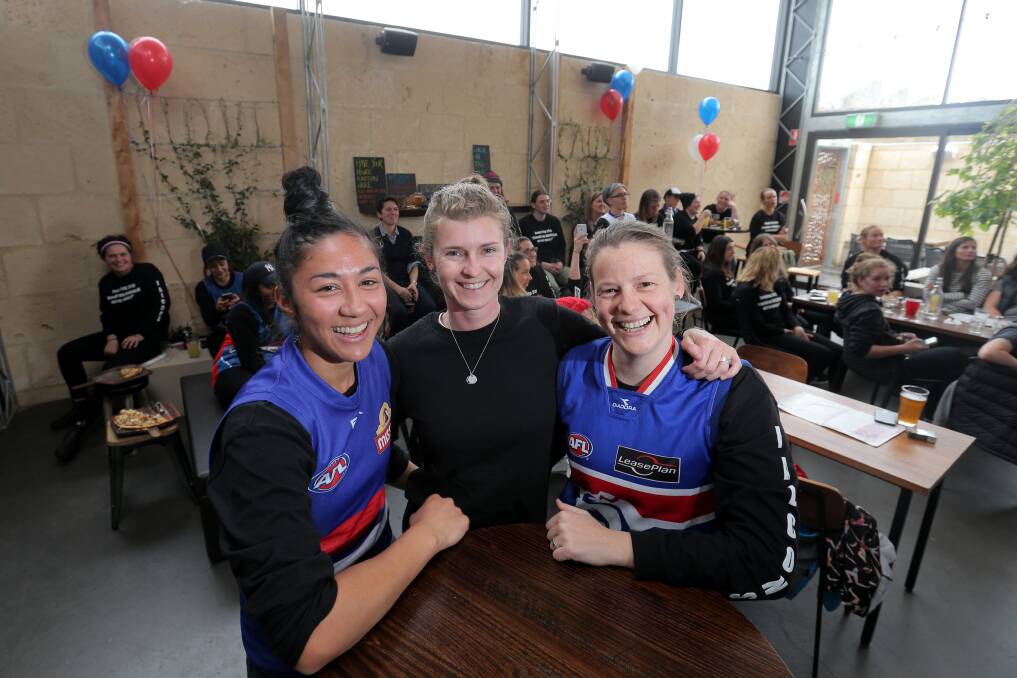 Darcy Vescio, Carly McCorkell and Jane Lange from the Darebin Football Club. Ms Vescio will play for Carlton's women's side next year, and Ms Lange will work for the team as an assistant coach. Picture: Vicky Hughson