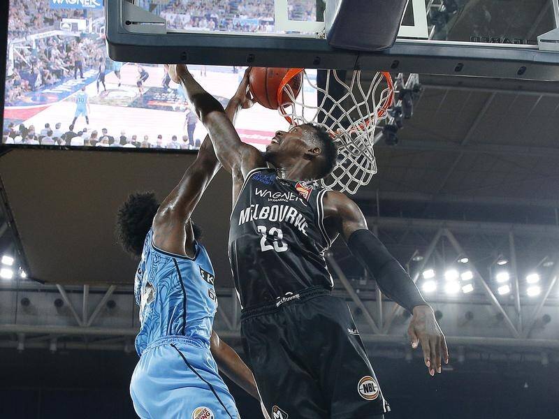 Melbourne's Casey Prather tries to block a shot during the NBL semi-final against the NZ Breakers.