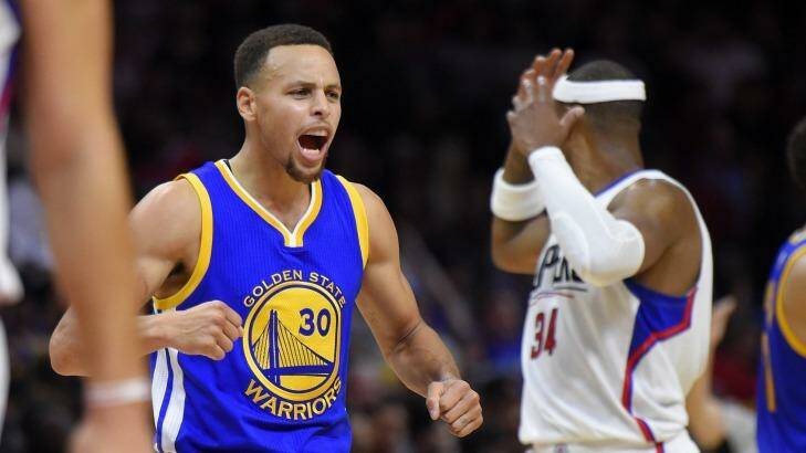 Pumped: Golden State Warriors guard Stephen Curry celebrates during the win over the Los Angeles Clippers. Photo: Mark J. Terrill