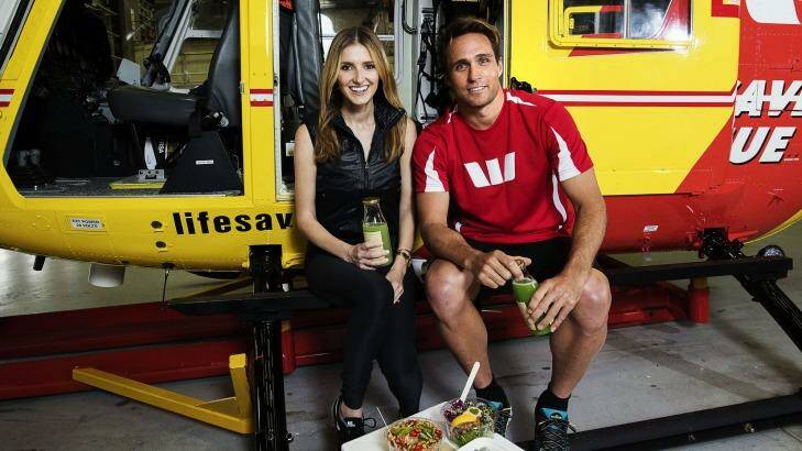 Ky Hurst, here with Kate Waterhouse, is an ambassador for the Westpac Lifesaver Rescue Helicopter Service. Photo: Christopher Pearce Photo: Christopher Pearce