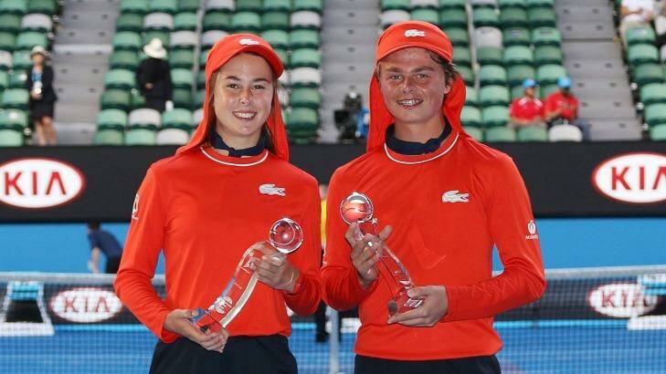 Zoe Carr (left) and Sam McLachlan get their moment of glory after being named the top ballkids of this year's Open. Photo: Graham Denholm