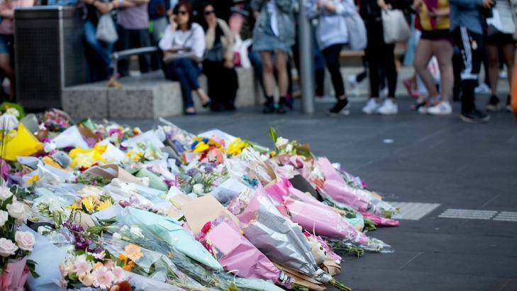 Part of Bourke Street Mall has become a shrine to victims of Friday's tragedy. Photo: Arsineh Houspian