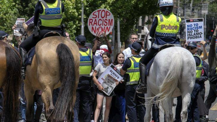 Anti-racism protesters during simultaneous rallies outside State Parliament. Photo: Luis Ascui