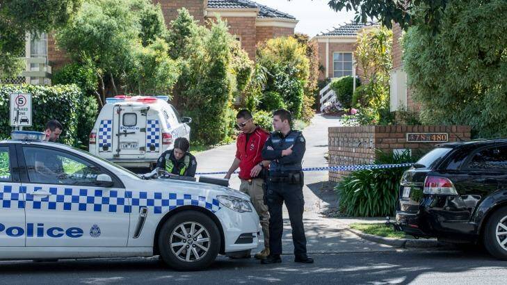 Police outside the Mitcham unit complex on Monday.  Photo: Justin McManus